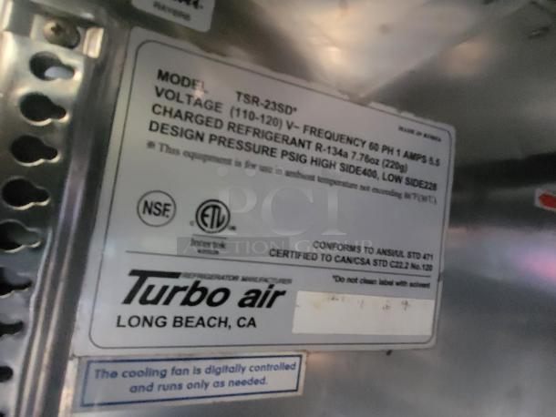 Label on Turbo Air Refrigerator: Model TSR-23SD, voltage 110-120V, refrigerant R-134a, conforms to ANSI/UL standards.