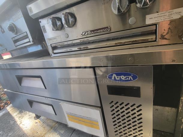 2004 Freightliner MT45 Mobile Kitchen interior featuring Southbend gas griddle and Atosa chef base in stainless steel.