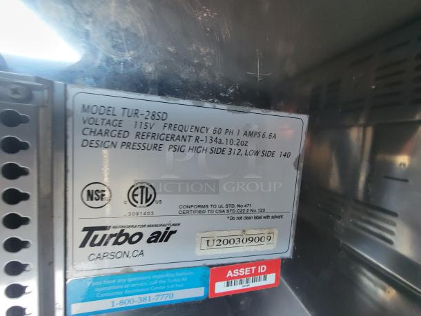 Turbo Air refrigeration label in mobile kitchen trailer. Model TUR-28SD, 115V, uses R-134a refrigerant, NSF and ETL certified.