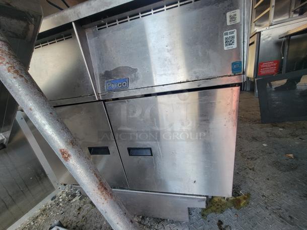 Stainless steel commercial kitchen appliance in trailer. Features Pitco branding, NSF certification, and QR code stickers.