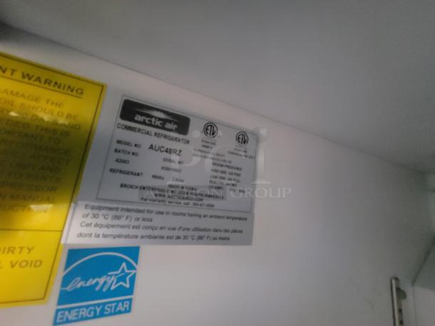 Arctic Air commercial refrigerator label showing model AUC48RZ, batch number and energy-efficient R600a refrigerant.