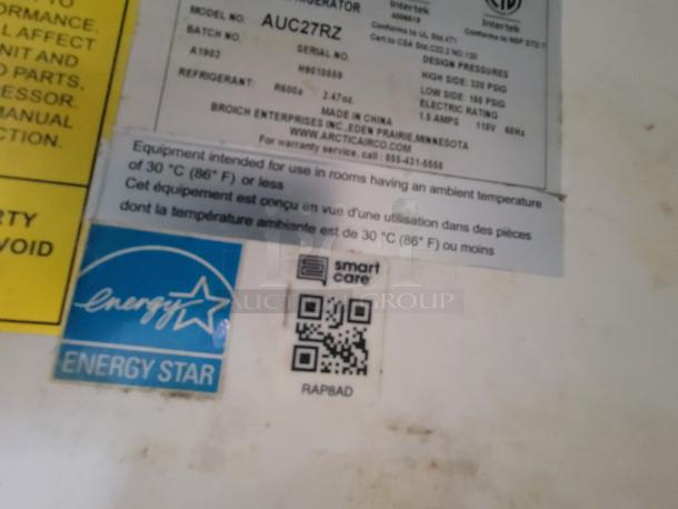 Energy efficiency labels and QR code on mobile kitchen equipment panel, indicating R600a refrigerant use, Energy Star rating.