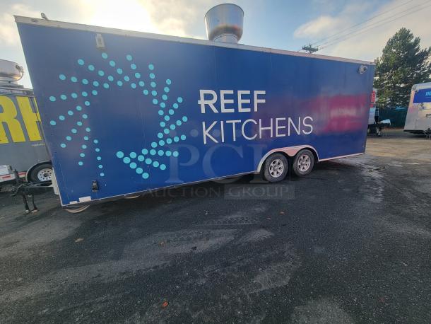 24' Diamond Cargo mobile kitchen trailer with "Reef Kitchens" logo, equipped for catering, excellent condition.
