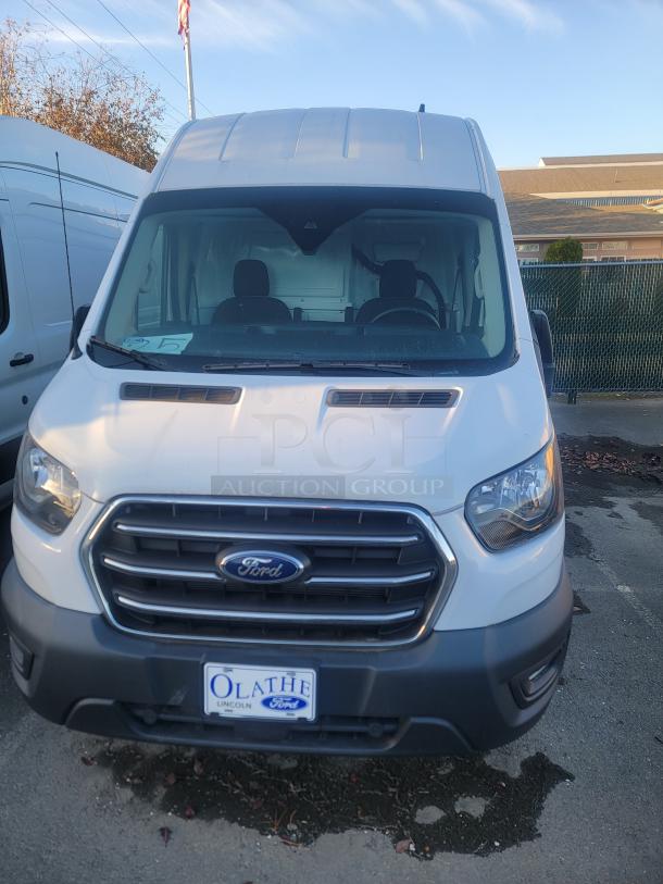 2021 Ford Transit 350 Cargo Van with high roof, low mileage at 2,023.8 miles, SRW, 148-inch wheelbase. Near-new condition.