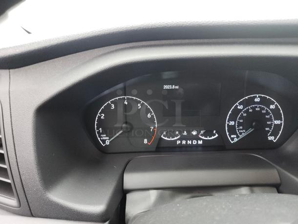 2021 Ford Transit 350 dashboard showing 2,023.8 miles, indicating exceptionally low mileage for the vehicle.