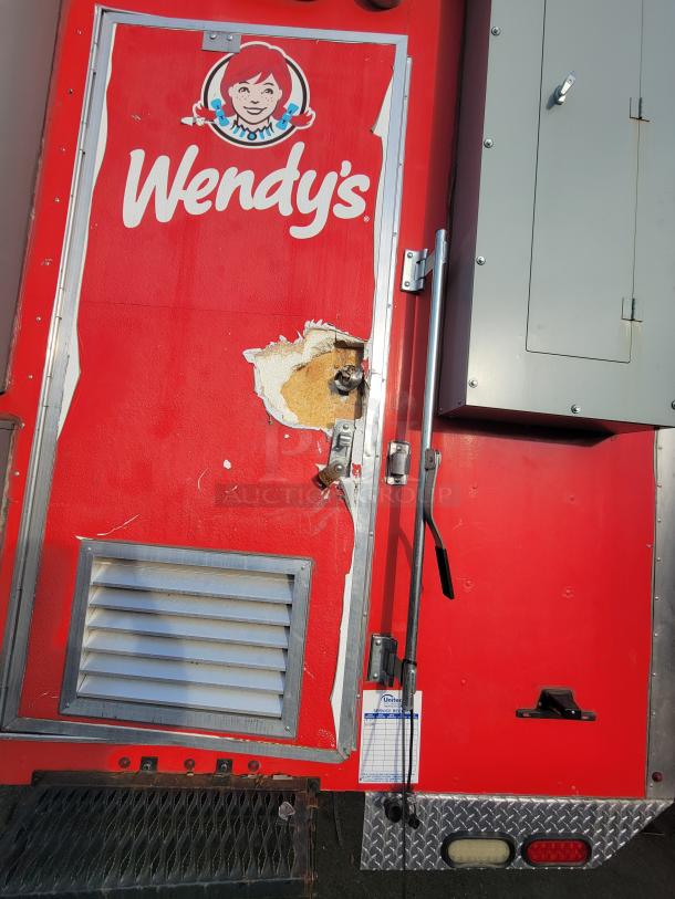2021 Texino 28-foot food trailer with Wendy's branding, showing minor exterior damage. Fully equipped for high-volume service.