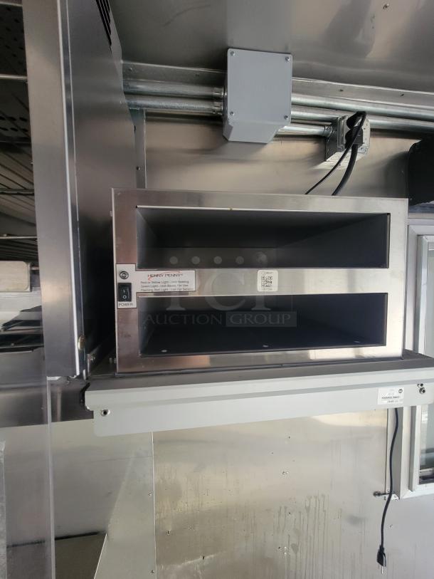 Stainless steel Henny Penny Heated Holding Cabinet in a 2021 Texino 28-foot food trailer; used for high-volume food service.