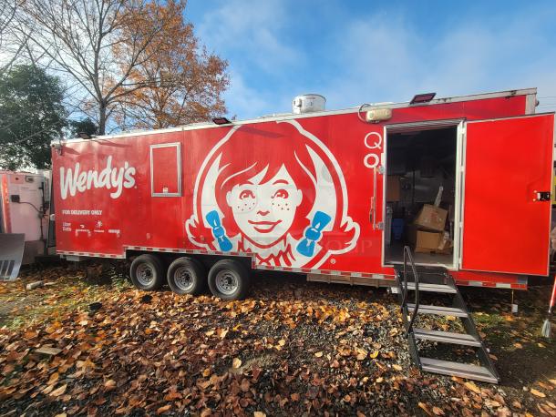 2022 Rock Solid 28' food trailer, pristine condition, Wendy's branding, equipped with top commercial kitchen equipment.