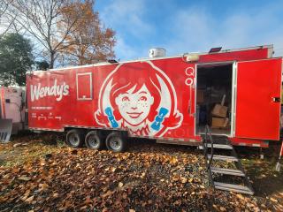 2022 Rock Solid 28' food trailer, pristine condition, Wendy's branding, equipped with top commercial kitchen equipment.
