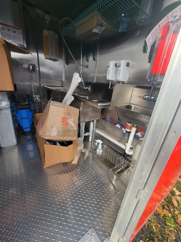 2022 Rock Solid 28' food trailer interior, featuring pristine, unused commercial-grade kitchen equipment.