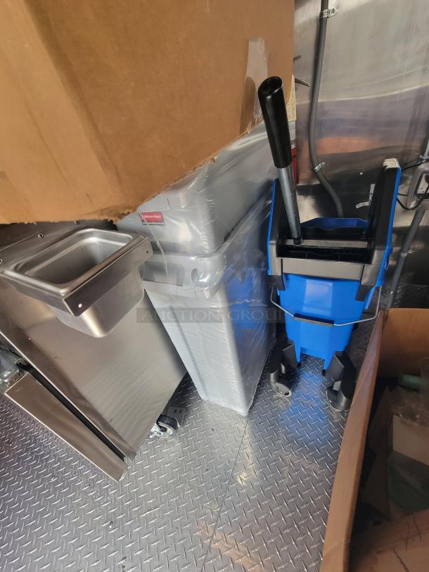 2022 Rock Solid 28' food trailer interior, featuring unused high-end equipment and pristine surfaces, ready for service.