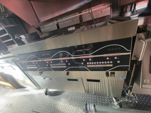 2022 Rock Solid 28' food trailer interior with new Henny Penny cooking equipment, stainless steel finish, never used.