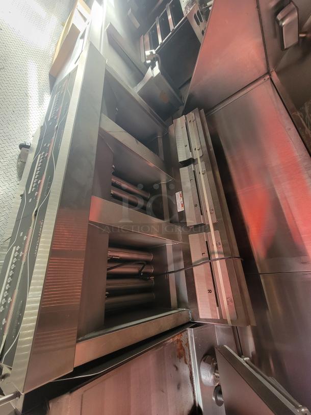 Alt text: "2022 Rock Solid 28' food trailer interior, featuring new commercial-grade equipment. Stainless steel finish, never used."