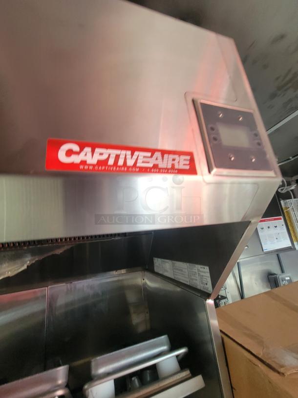 2022 Rock Solid 28' food trailer with CaptiveAire hood system. Unused, equipped with new, top-grade commercial kitchen appliances.