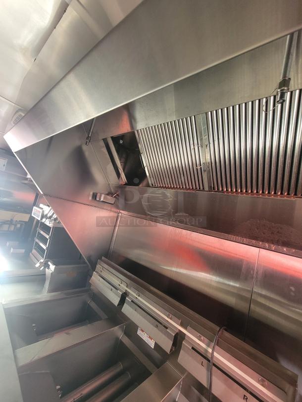 2022 Rock Solid 28' food trailer interior with new commercial equipment, stainless steel finish, pristine condition.