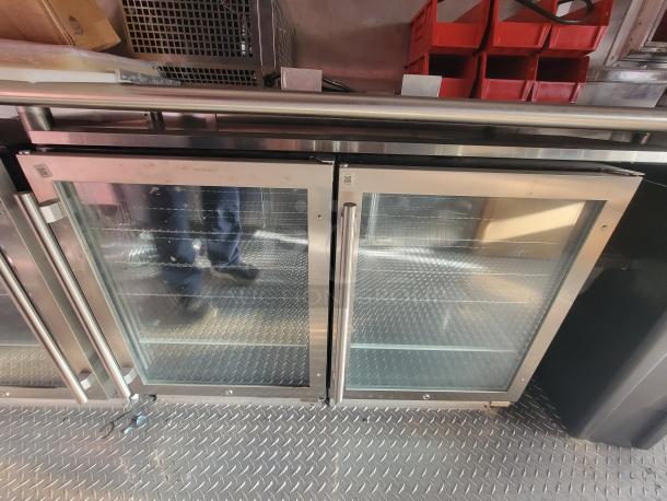 2022 Rock Solid 28' food trailer with glass door refrigeration units, new and unused, premium commercial equipment.