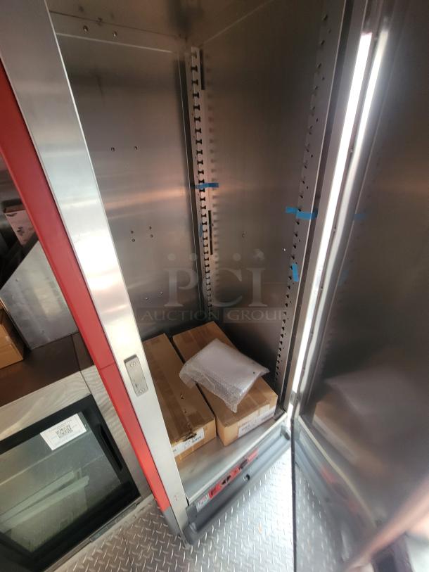 2022 Rock Solid 28' food trailer interior, new equipment inside, pristine condition, commercial-grade build.