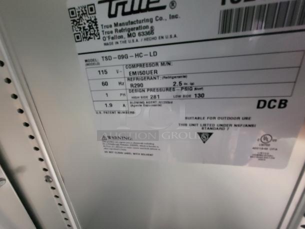 Label inside a 2022 Rock Solid 28' Food Trailer. Model: TSD-09G-HC-LD. Features voltage, refrigerant, and design pressure details.