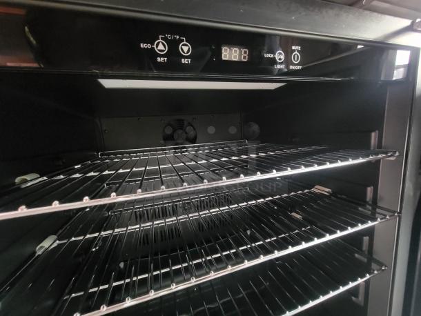 Industrial-grade oven inside a 2022 Rock Solid 28' food trailer, showing digital controls and unused racks.
