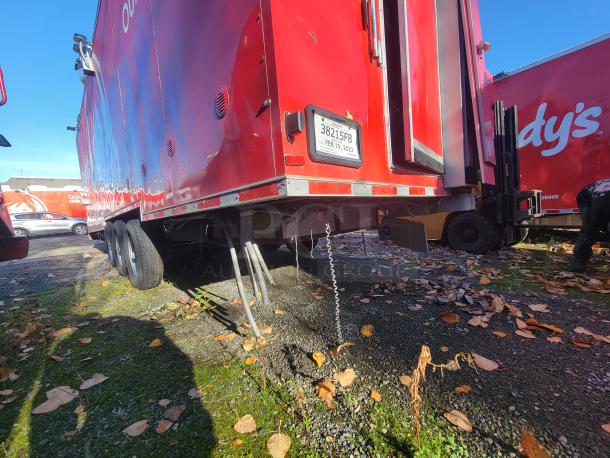 AS-NEW 2021 Titanium 28' food trailer, red exterior, pristine condition, high-capacity, professional, unused equipment.