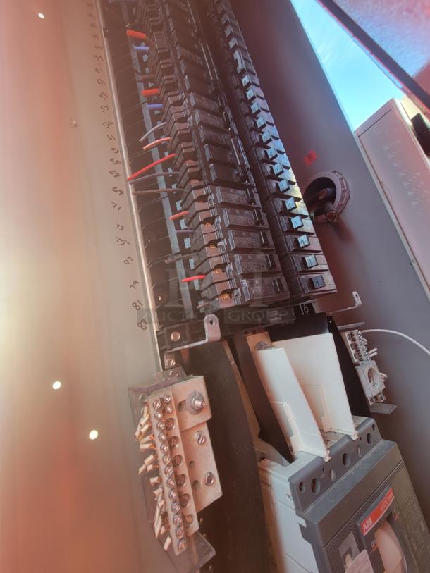 Electrical panel inside the 2021 Titanium 28' food trailer, showing new, unused circuit breakers and wiring.