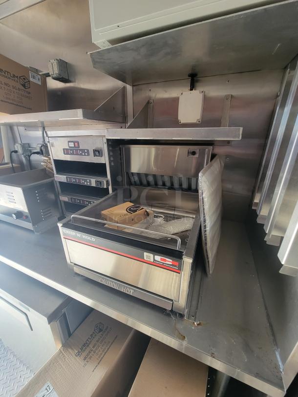 2021 Titanium 28' food trailer, pristine condition, unused professional-grade equipment. Factory protective materials visible.