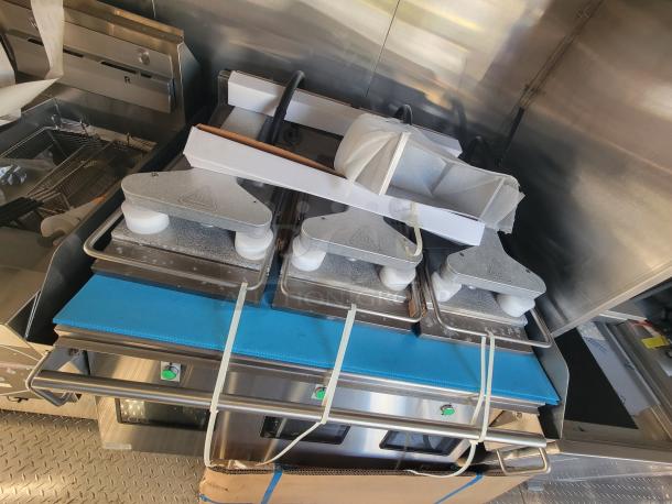 2021 Titanium 28' food trailer, as-new, unused equipment with protective materials, high-capacity commercial kitchen.