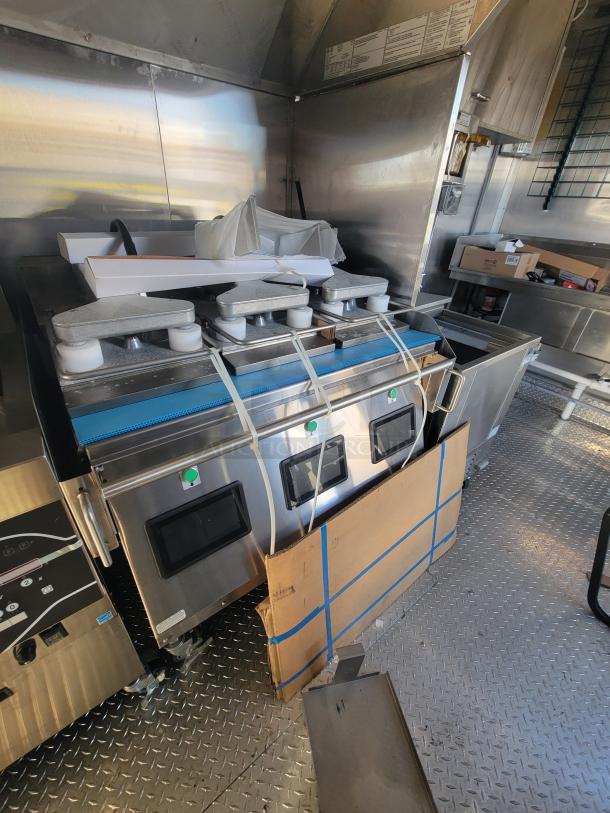 2021 Titanium 28' Food Trailer, pristine condition, unused equipment with protective material, professional-grade interior.