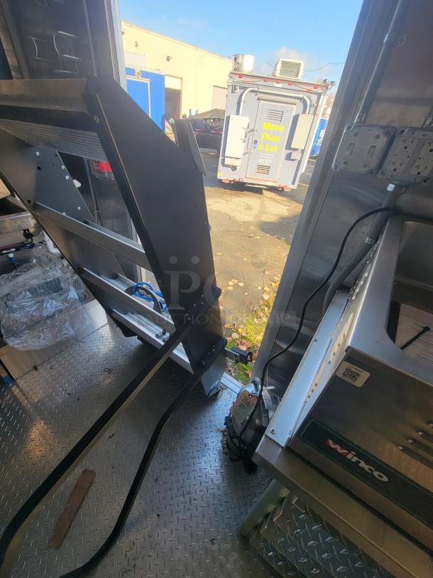 Pristine 2021 Titanium 28' food trailer, never-used pro kitchen, factory protective material, high-capacity and custom-built.