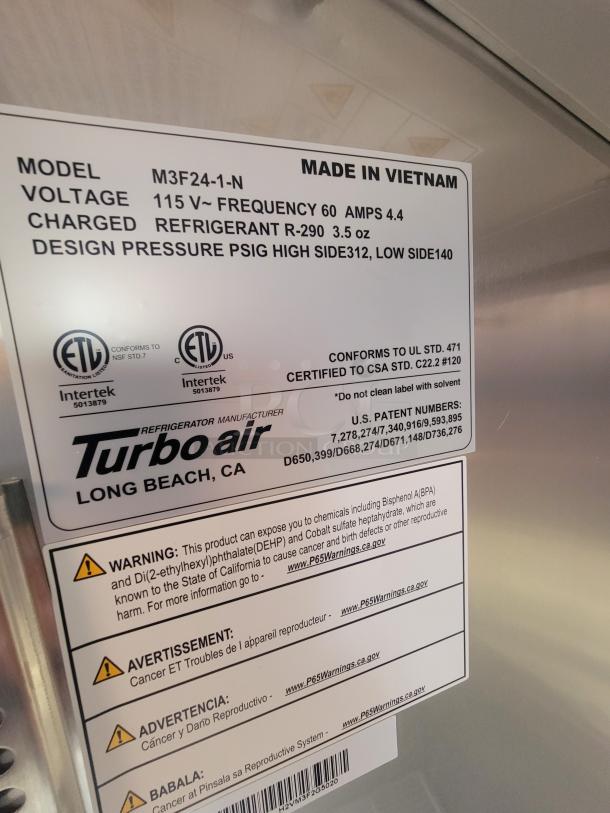 Label on new Turbo Air refrigerator in Titanium 28' food trailer, model M3F24-1-N, 115V, 60Hz, made in Vietnam.