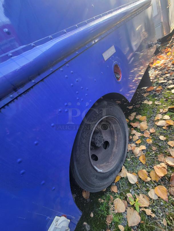 Blue 2003 Workhorse P24 diesel food truck, exterior detail. Built on reliable Chevrolet chassis, ready for high-volume service.