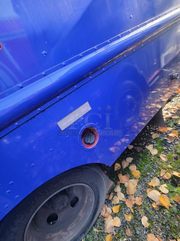 Blue 2003 Chevrolet Workhorse P24 food truck with "Diesel Fuel Only" label. Custom-built, turnkey commercial kitchen.