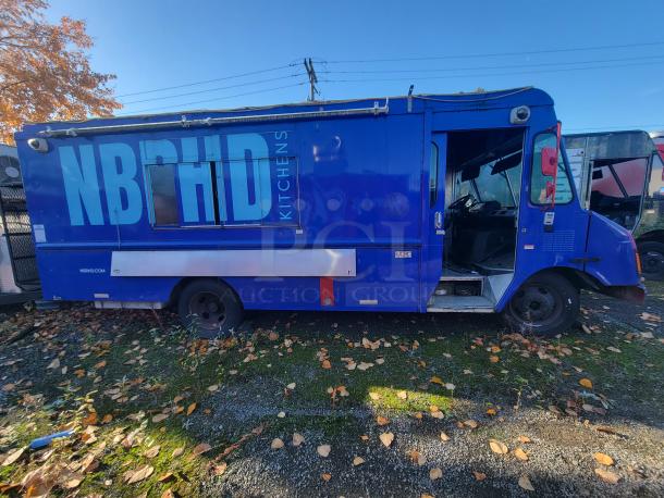 2003 Workhorse P24 food truck with custom high-quality commercial kitchen. Blue exterior, NBHD Kitchens branding. Turnkey condition.