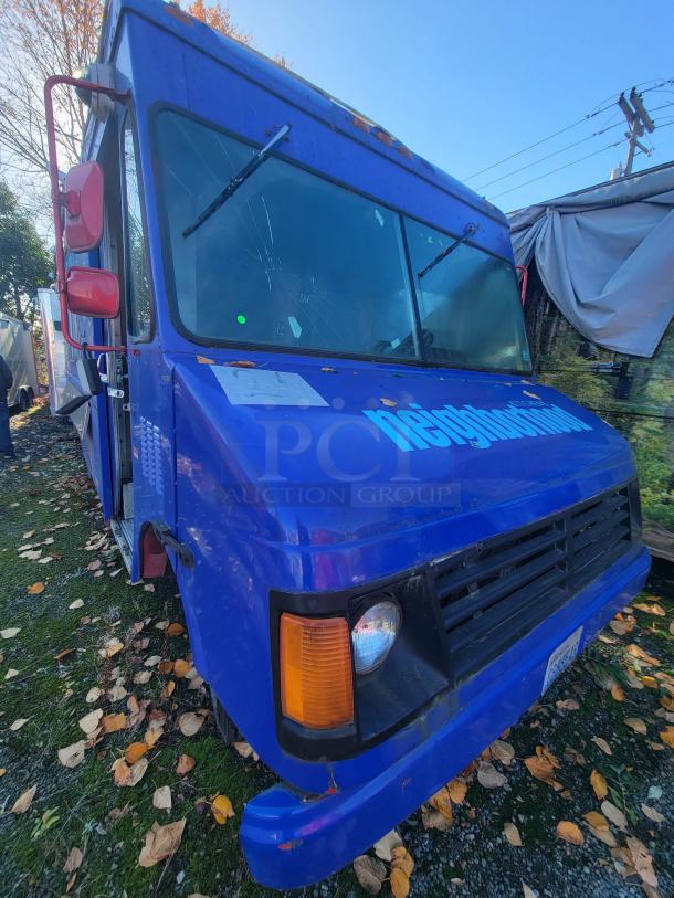 Blue 2003 Workhorse Diesel Food Truck on Chevrolet P24 chassis with a custom commercial kitchen. Visible exterior wear.