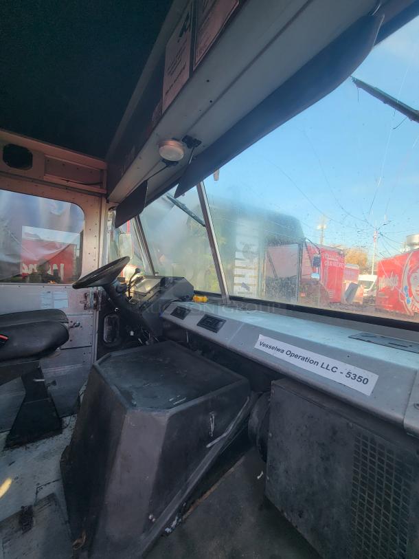 2003 Chevrolet Workhorse P24 food truck interior; custom-built kitchen; Vesselwa Operation LLC label visible.