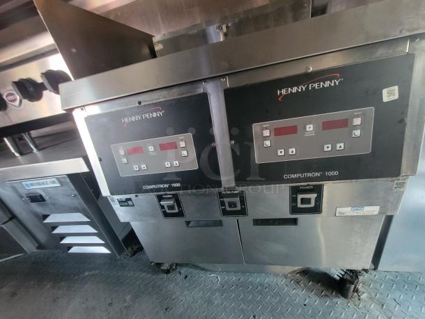 Henny Penny Computron 1000 controllers in a 2003 Workhorse food truck kitchen, featuring commercial appliances.
