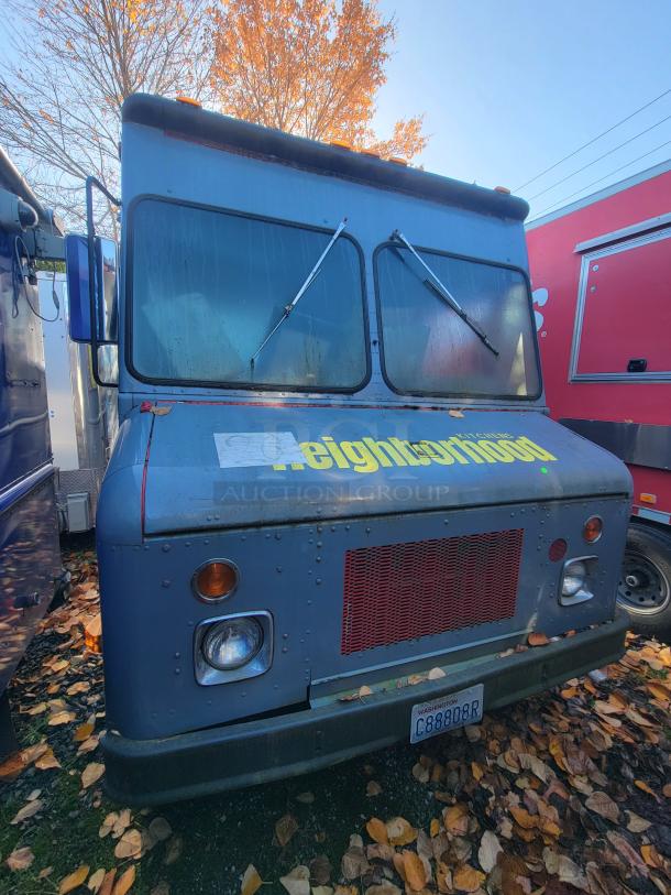 1973 International Step Van with fire/smoke damage, still contains stainless steel kitchen equipment for salvage. Sold as-is.