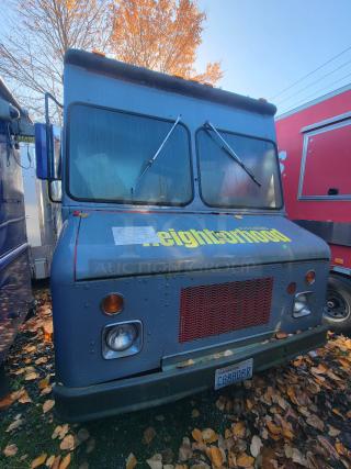 1973 International Step Van with fire/smoke damage, still contains stainless steel kitchen equipment for salvage. Sold as-is.