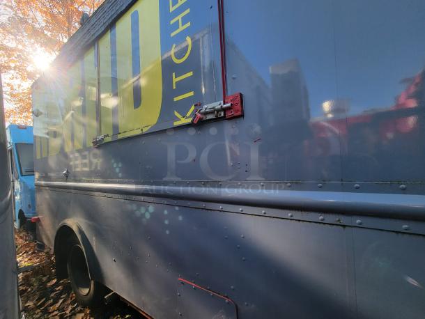 1973 International Step Van showing exterior with visible commercial kitchen branding and side latch, suitable for salvage.