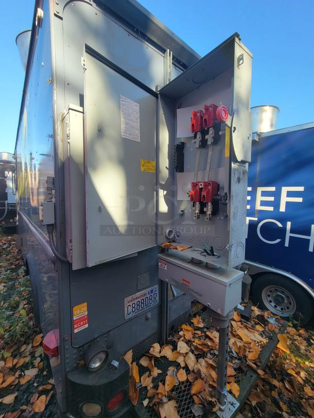 1973 International Step Van with fire-damaged kitchen, showing a utility panel open. Includes salvageable stainless steel equipment.