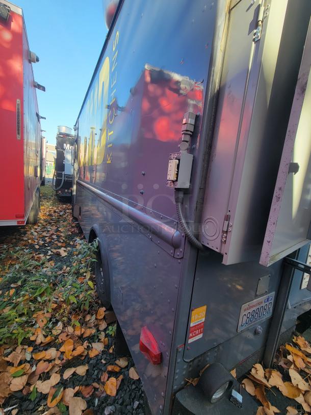 1973 International Step Van with fire and smoke damage; features professional-grade kitchen equipment. As-is, salvage project.