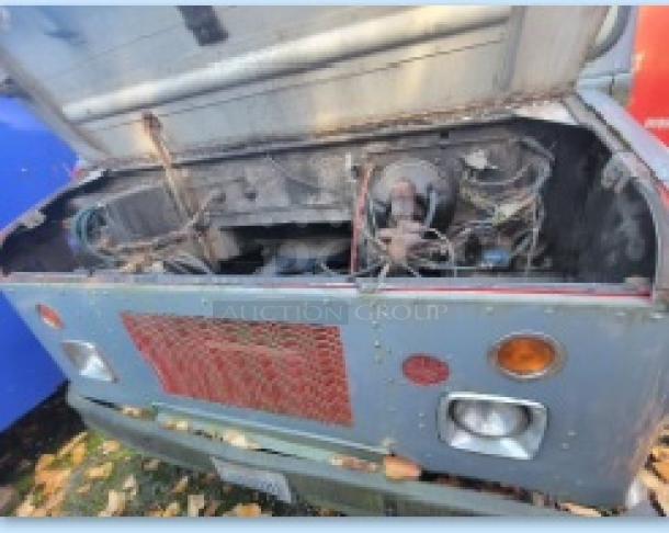1973 International Step Van with open hood, showing fire damage and smoke-affected kitchen equipment. Ideal for salvage or restoration.