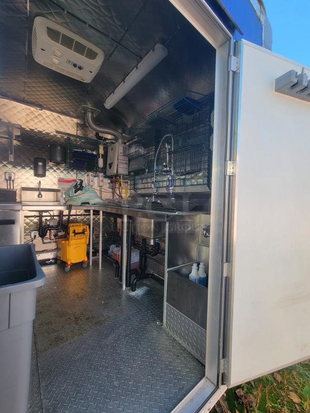 2021 24' Quality Trailer with high-capacity commercial electric kitchen; features top-tier appliances, pristine condition.