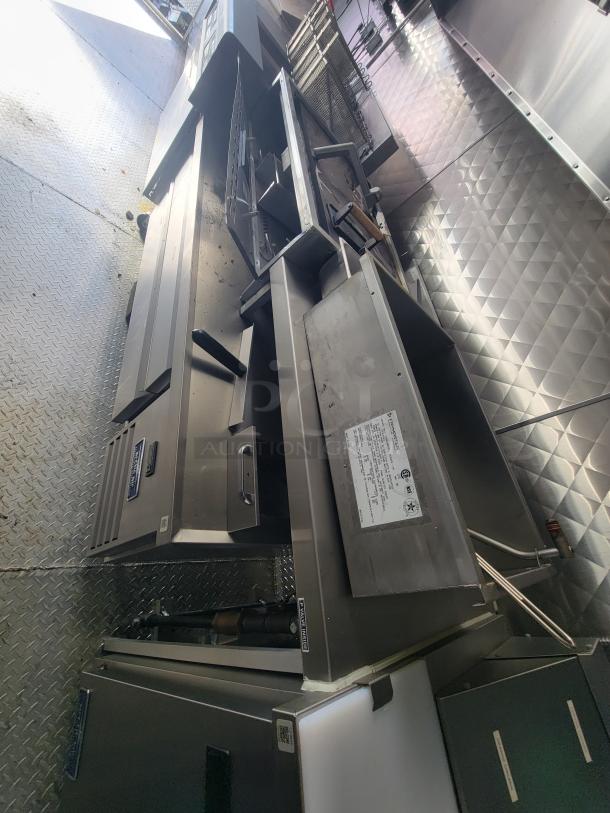 2021 24' Quality Trailer, fully equipped electric kitchen with commercial-grade appliances, excellent condition, sleek design.