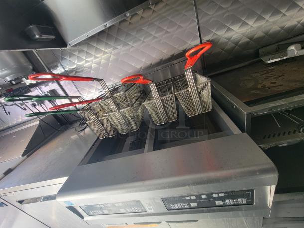 2021 24' Quality Trailer with commercial electric kitchen, featuring fryers and griddle. Excellent condition, high-capacity equipment.