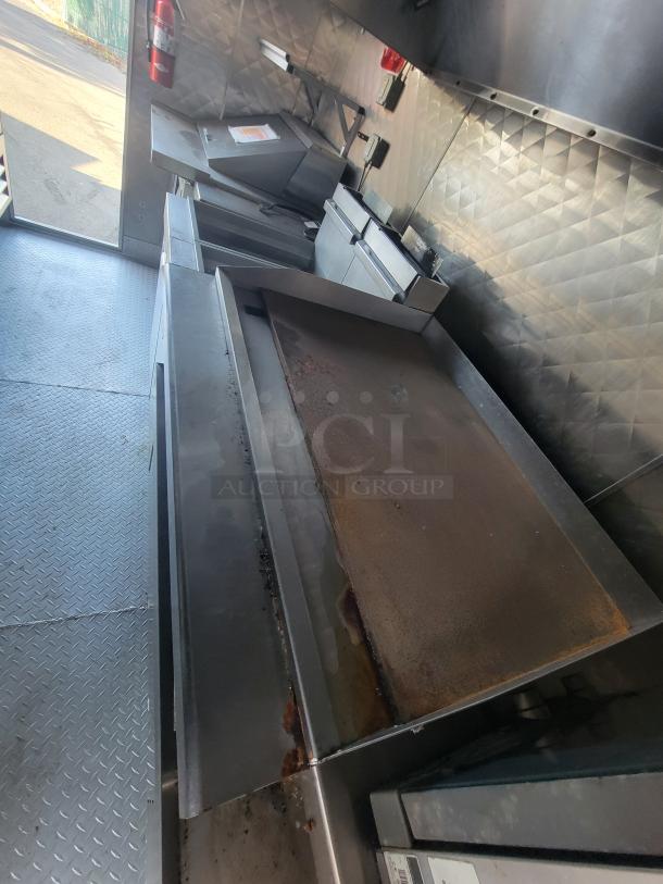 2021 16' Quality food trailer interior, featuring Vulcan cooking appliances, Arctic Air refrigeration, clean stainless-steel surfaces.