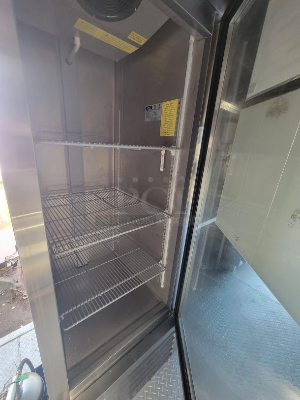 16' 2021 Quality food trailer with Arctic Air fridge interior, three metal shelves, and inspection-ready setup.