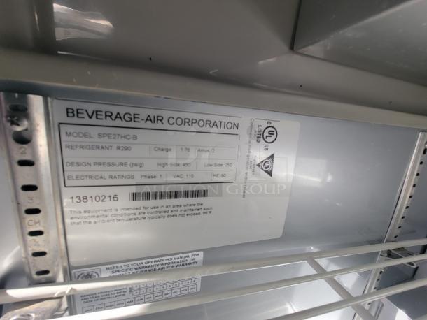 Beverage-Air label inside commercial food trailer, Model SPE27HC-B. Refrigerant R290, design pressure 450 psig, UL listed.