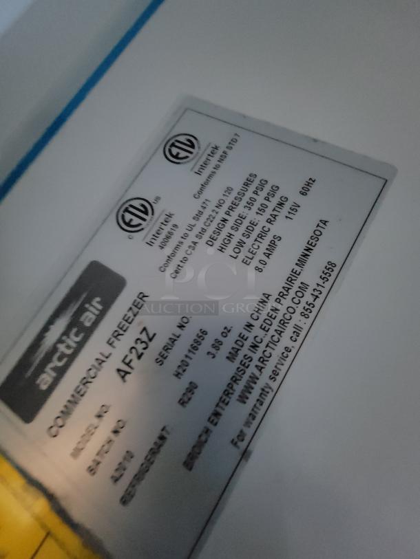 Arctic Air AF23Z commercial freezer label showing model, serial number, design pressures, and electrical ratings.