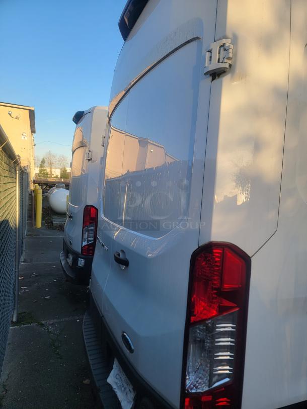 2020 Ford Transit 350 Cargo Van with high roof, 148-inch wheelbase, and low 2,212 miles, visible in excellent condition.